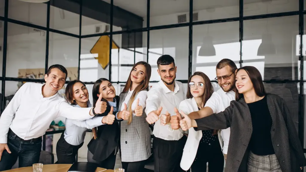 Employee Benefits-employees in an office showing thumbs up – highlighting employee benefits in Bangladesh including provident funds, gratuity funds, and maternity leave Bangladesh.